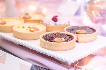close up baked fruit tarts