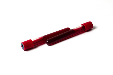 Two test tubes with blood isolate on a white background. The concept of medicine, the fight against viruses and bacteria, diseases