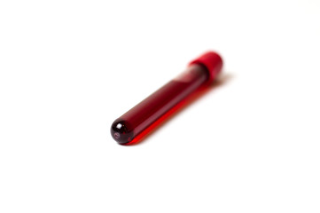 Test tube with blood isolate on a white background