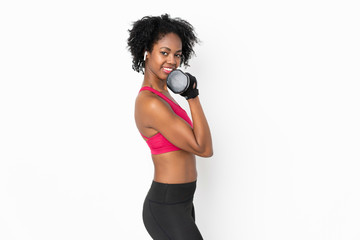 Young African American woman isolated on white background making weightlifting