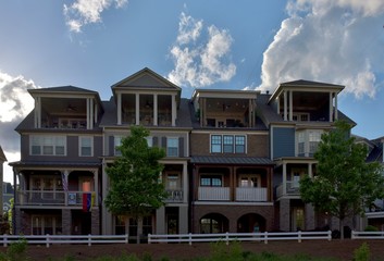 Row houses with a blue sky and clouds