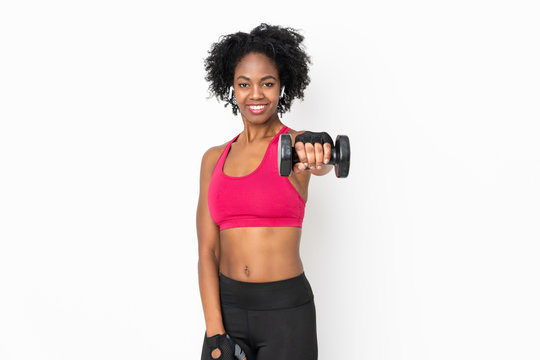 Young African American woman isolated on white background making weightlifting
