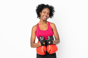 Young African American woman isolated on white background with boxing gloves