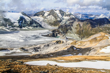 Dramatic panoramic view of the swiss alps with high alpine landscape as seen from the top of...