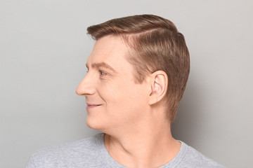 Fototapeta premium Portrait of blond mature man with happy expression and smiling