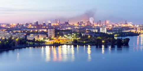 View of the evening city by the river. White nights in the city