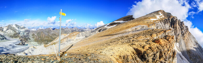 Dramatic panoramic view of a hiking trail in the swiss alps leading to the top of Barrhorn mountain...