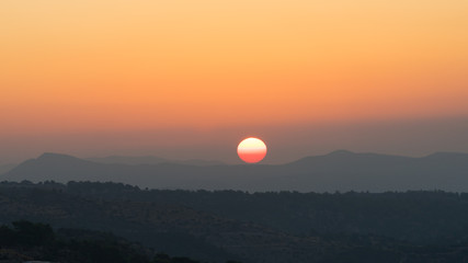 Amazing sunset behind the mountains in Cyprus.
