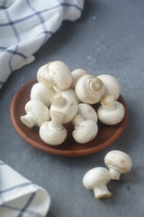 on a gray background in a plate of mushrooms