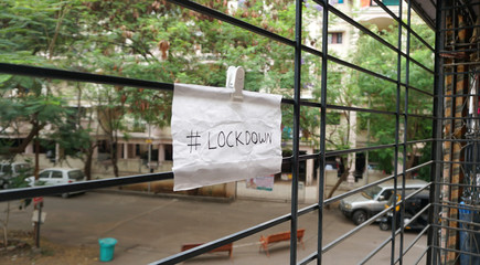 Lockdown sign on a window of building  as a referral to the Coronavirus pandemic in the India. 