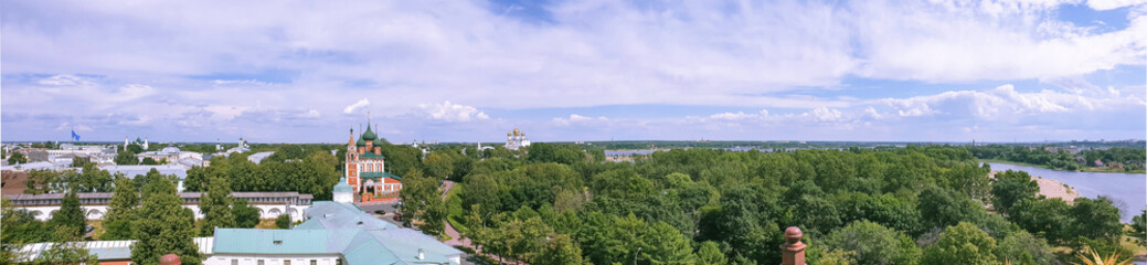 View of the Church of St. Michael the Archangel and the assumption Cathedral through the round window of the belfry of the Transfiguration monastery.