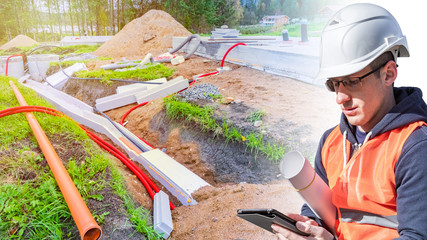 Engineering communications design. Engineer at a construction site. The builder is looking at the...