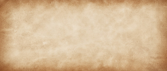 Long panoramic  vintage retro antique paper background. Light yellow-brown old paper texture. Rustic abstract old surface with vignette and copy space.