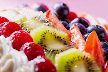 fruit cake with raspberries, strawberries, blueberries and kiwis