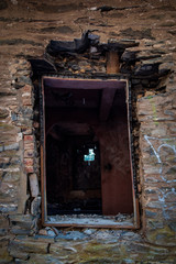 Fototapeta na wymiar Window in an old abandoned house