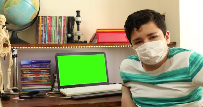Home Isolation Concept  Epidemic Infection Covid-19 Distance Education At Home With Green Screen Laptop Monitor
