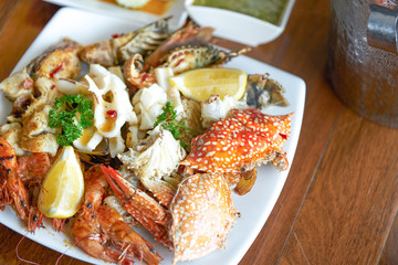 seafood on plate with spocy tasty dipping sauce