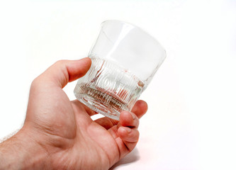 Tumbler Highball empty in man hand isolate on white