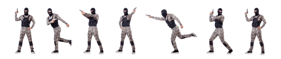 Soldier in camouflage with gun on white