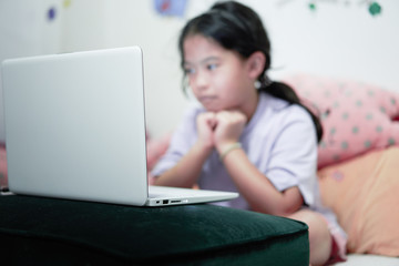 asian girl learning online at home in quarantined time of covid 19