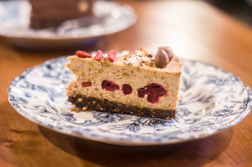 Syroid cake with almonds and cherry.