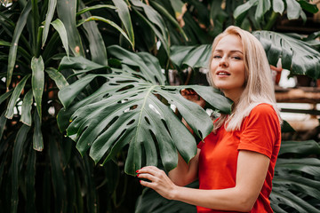 Blonde woman in tropical forest