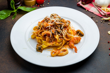 Pasta with seafood on a white plate
