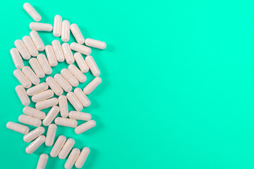 white tablets on a turquoise background. isolate