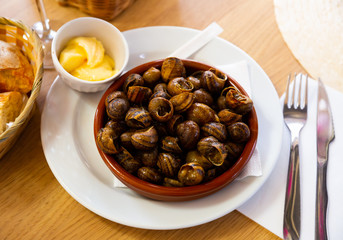 Fototapeta premium Boiled grape snails in bowl