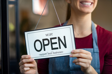 Open sign in a small business shop - Powered by Adobe