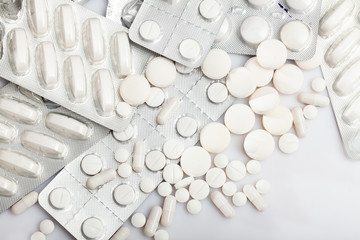 Tablets and capsules pills on white background