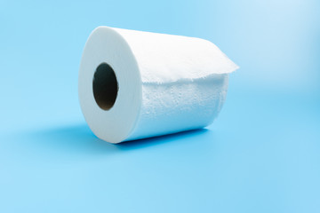 One toilet paper roll isolated on blue background