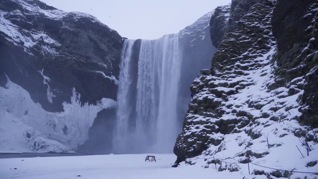 Sk&oacute;gafoss waterfall during the Icelandic winter.
