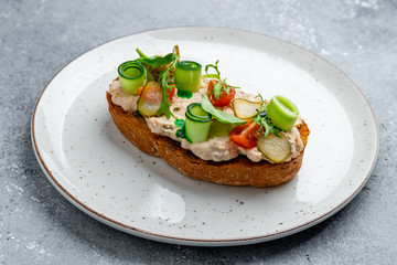 bruschetta with tuna on grey stone table