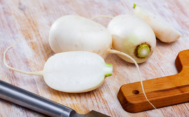 Whole and sliced white turnips