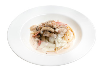 Italian pasta spaghetti carbonara with bacon in ceramic plate isolated on white background, clipping path included