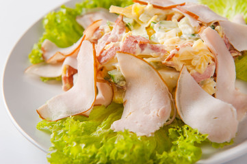 healthy salad in a white plate on a white background. Healthy eating Salad close up