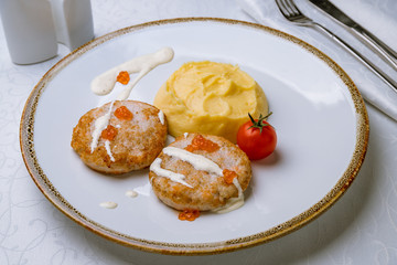 cutlets of pike with mashed potatoes and red caviar