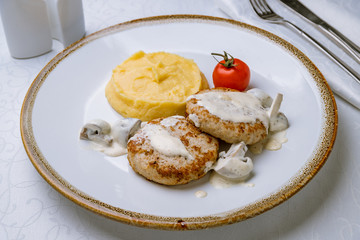 Chicken cutlets with mashed potatoes and mushroom sause
