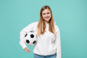 Smiling young woman girl football fan in casual white hoodie posing isolated on blue turquoise...