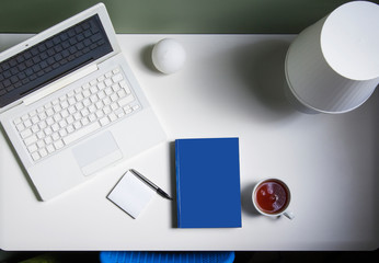 Modern workspace with coffee cup, smartphone, paper, laptop, tablet and laptop for copy space on a white color background. View from above. Flat style.
