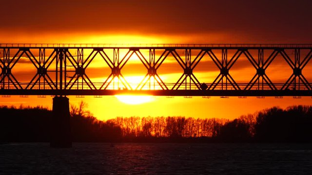 Railway bridge over the river at the stunning dawn