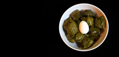 Uzbek traditional dish green pilaf in bag on white plate. Classic central asian Bukharian jewish cuisine.