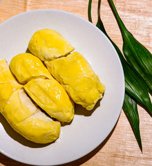 A beautiful yellow fruit with three leaf.