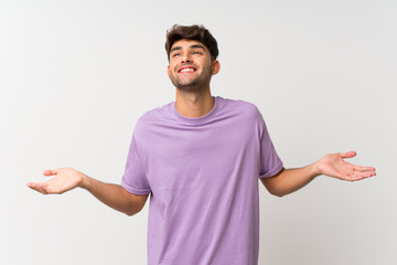 Young handsome man over isolated white background smiling a lot