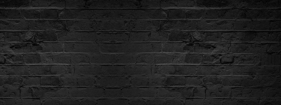 Dark black anthracite damaged rustic brick wall texture banner panorama
