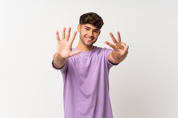 Young handsome man over isolated white background counting eight with fingers