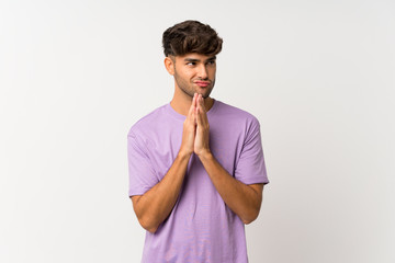 Young handsome man over isolated white background scheming something