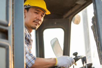 Engineer drive backhoe,Excavator loads gravel in a heavy mining truck,Construction concept.