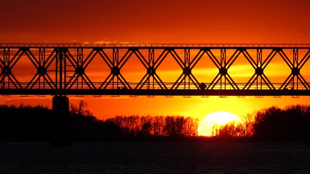 Railway bridge over the river at the stunning dawn